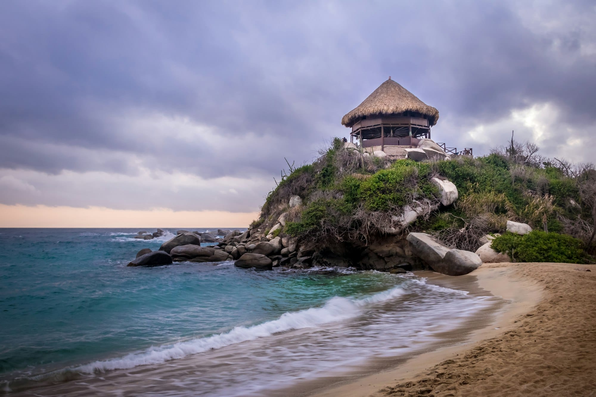 Sunset and beach hut at Cabo San Juan - Tayrona Natural National Park, Colombia